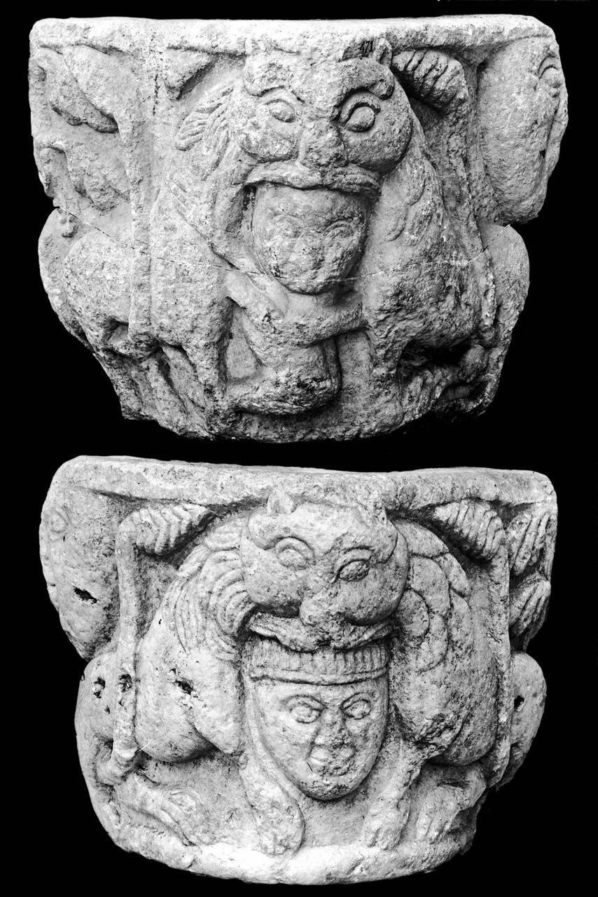 Capitello figurato con coppia di leoni affrontati azzannanti una testa maschile e un uomo (capitello) di Scultore - ambito lombardo (fine/ inizio sec. XI)