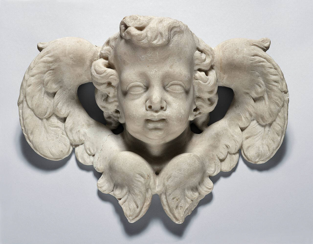 Cherubino, in pendant (testa) di Scultore - ambito lombardo (fine/inizio sec. XVII)